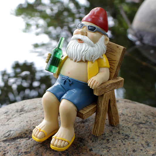 Drusiana - Statue de gnome charmant pour bronzer en résine avec chaise longue de luxe pour décoration de jardin enchanteresse